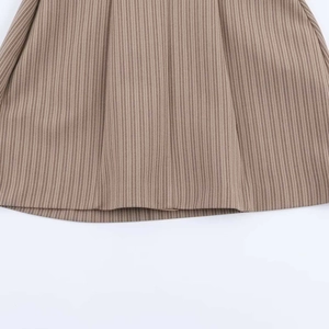 Detail of striped hem and pleated texture on a vintage sleeveless V-neck summer dress