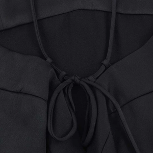 Elegant black backless satin top with criss-cross spaghetti straps and tie-back detail