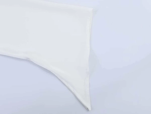 Detail of white chiffon fabric showing professional flat seam stitching and texture