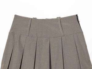 Detailed view of high-waist plaid pleated skirt showing fine texture and side zipper