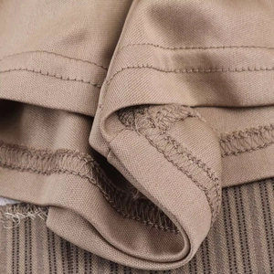 Detailed close-up of double-needle stitching and hem finish on striped mini dress