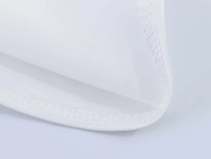Close-up of high-density white chiffon fabric with fine stitching and smooth seam details