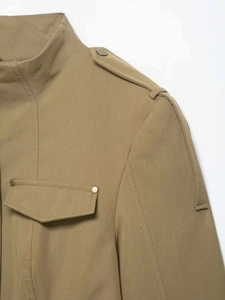 Detail view of khaki tactical jacket showing shoulder epaulettes and flap chest pockets