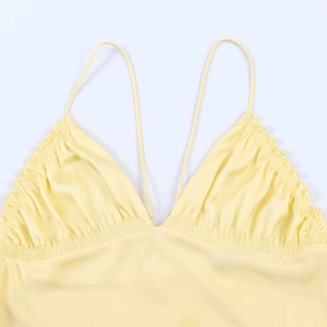 Elegant yellow satin camisole top with V-neckline and refined pleated detailing