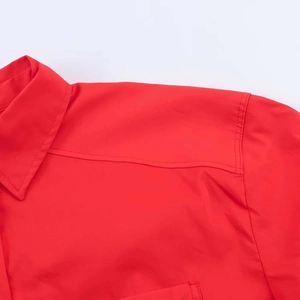 Close-up of lapel collar and reinforced double stitching on this red casual shirt