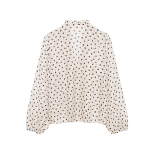 Detailed flat lay of cream ruffled high neck chiffon blouse with brown polka dot pattern