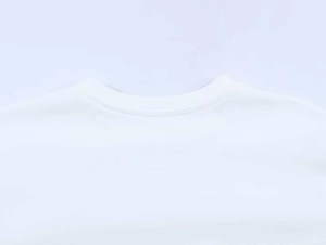 Close-up of neckline stitching detail on white cotton blend long sleeve lace t-shirt