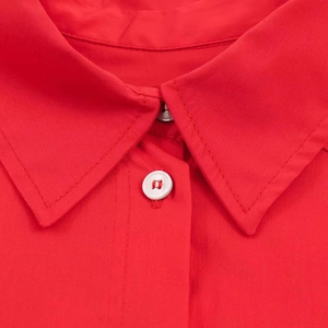 Classic red turn-down collar shirt with white buttons and fine textured fabric
