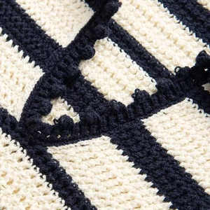 Summer loose V-neck hollow knit sweater with chic black and white crochet striped details