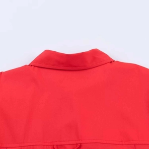 Detailed close-up of the red shirt collar and back shoulder stitching and texture