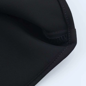 Close-up of black asymmetric mini dress with premium diagonal weave and neat stitching