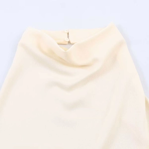 Beige halter neck top with draped pleated neckline and back button closure