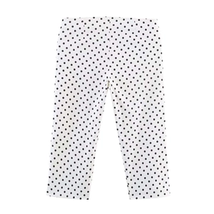 Detailed flat lay of white trousers with black polka dots featuring a clean tailored waistline