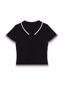 Detail of black cable knit Polo shirt featuring white contrast stripes on collar and cuffs