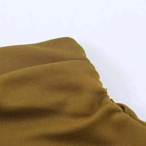 Detailed macro view of the mustard yellow knit fabric texture and high-quality stitching