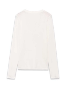 Flat lay of white knit long-sleeve top showing smooth fabric texture and round neckline