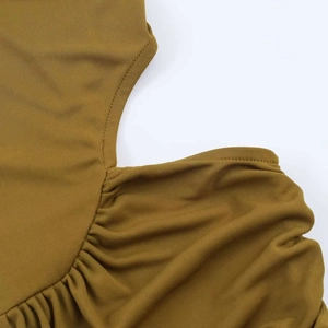 Fashionable ginger yellow wrap dress featuring side cutout and elegant ruched detailing