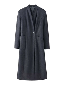 Detailed texture of charcoal grey wool blend coat with single button and v-neck design