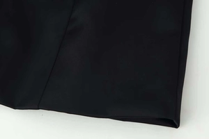 Detail of premium black polyester fabric showing smooth texture and flat seam edge
