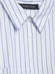 Close-up of the crisp collar and buttons on a blue and white striped shirt dress