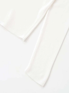 Close-up detail showing the fine texture and neat stitching of this white knitted sweater