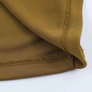 Detail shot showing high-quality mustard knit fabric texture and neat edge stitching