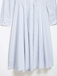 Close-up of the pleated waist detail and vertical blue stripes on this midi dress