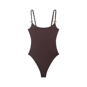 Detail of dark chocolate bodysuit featuring thin straps and gold metal ring accents
