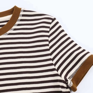 Detailed macro of the brown and white striped t-shirt with ribbed brown neckline