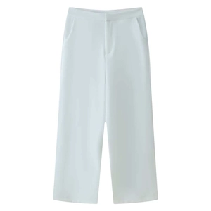 Detailed flat lay of white wide-leg trousers with high waist and smooth suit fabric