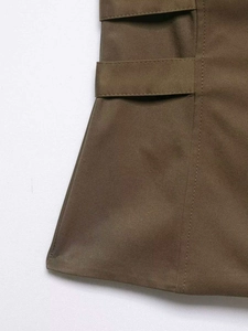 Detailed close-up showing twill texture and waist adjustment strap on a khaki vest