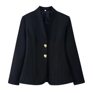 Detail of elegant black blazer with textured gold metal buttons and slim v-neck cut