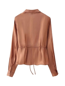 Detailed back view of caramel satin shirt with adjustable drawstring waist tie feature