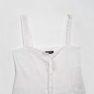 White lace camisole top with vintage embroidery, button front, and ribbon detail
