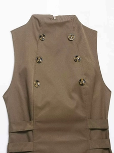 Detail of khaki high-neck sleeveless vest featuring double-breasted tortoiseshell buttons