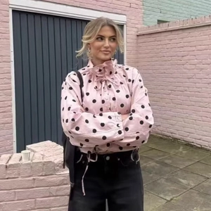 Pink polka dot long sleeve blouse with ruffle stand collar and bow tie details