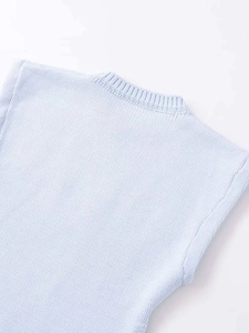 Close-up of light blue knit vest showing ribbed crew neckline and high-quality stitching
