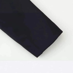 Close-up of elegant black stand-collar jacket with a slim-fit waist and knitted texture