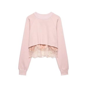 Detailed view of pink cropped sweatshirt with lace hem and ribbed neck details