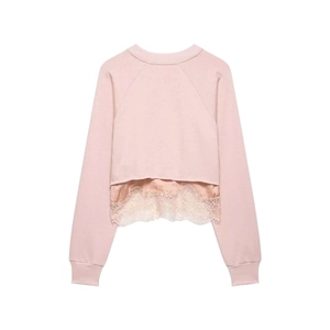 Detail of light pink sweatshirt back with lace hem and ribbed cuffs on white background