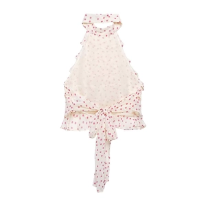 Detail of red polka dot halter top featuring backless design and large ribbon bow tie