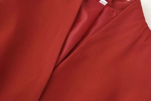 Close-up of red blazer lining and twill fabric texture with professional stitching