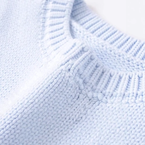 Minimalist light blue round neck knitted vest featuring a detailed ribbed texture