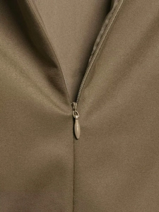 Close-up of khaki twill fabric with a matching invisible zipper detail for quality finish