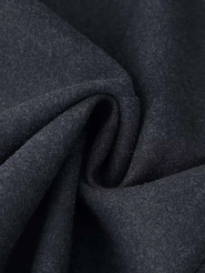 Macro shot of high-quality dark grey wool blend fabric with soft brushed texture