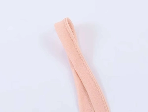 Detail view of pink strap fabric with premium texture and high-quality flat seam stitching