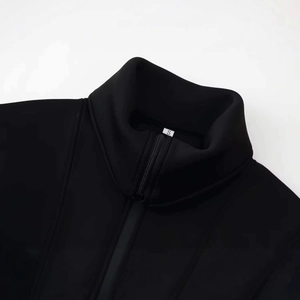 Minimalist black stand collar zip-up jacket for women with high neckline and smooth fabric