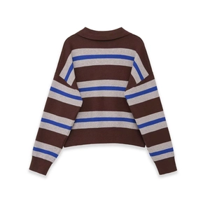 Detailed close-up of the striped knit sweater featuring brown, grey and blue wide horizontal bands