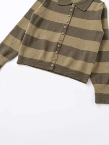 Close-up of olive green and khaki striped knit cardigan with ribbed cuffs and buttons