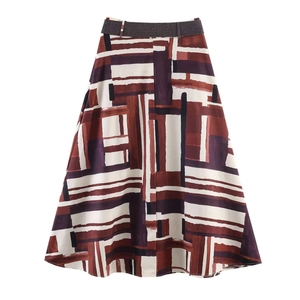 Modern high-waisted A-line skirt with geometric print and woven belt on white background